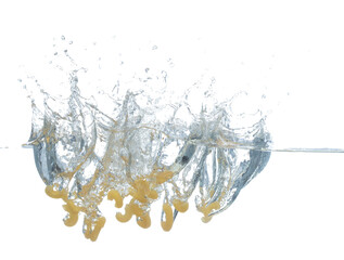 Raw pasta macaroni falls into water and creates air bubbles on surface. Yellow pasta macaroni drop hit smash to boil water and deep to bubble. White background isolated freeze motion
