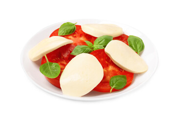 Plate of delicious Caprese salad with tomatoes, mozzarella and basil isolated on white