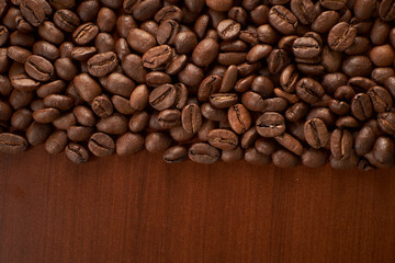 Aromatic Elegance: A close-up masterpiece capturing the intricate details of coffee beans on a rich wooden texture. The interplay of texture and aroma unfolds against a warm backdrop