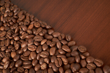 Aromatic Elegance: A close-up masterpiece capturing the intricate details of coffee beans on a rich wooden texture. The interplay of texture and aroma unfolds against a warm backdrop