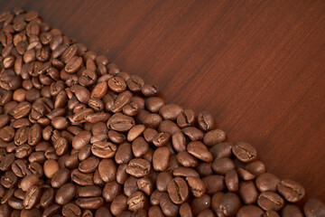 Aromatic Elegance: A close-up masterpiece capturing the intricate details of coffee beans on a rich wooden texture. The interplay of texture and aroma unfolds against a warm backdrop