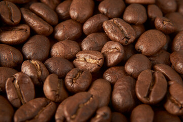 Aromatic Elegance: A close-up masterpiece capturing the intricate details of coffee beans on a rich wooden texture. The interplay of texture and aroma unfolds against a warm backdrop