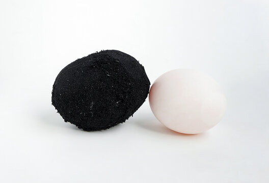 Salted duck egg made from covering fresh duck egg in damp, heavily salted charcoal made into a black clayish paste. 