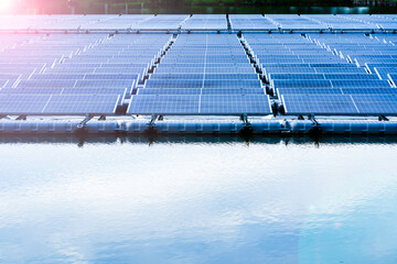Side view of solar panels floating on water in a lake, for generating electricity from sunlight, selective focus, soft focus..