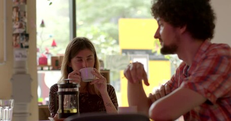 Portrait young couple solves relationship problems, people lifestyle. Honest conversation is openly discussing issues concerns. Dialogue in cafe. Discuss feelings, concerns, perspectives and viewpoint