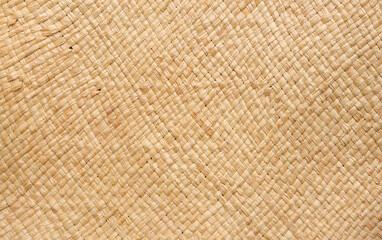 Brown wicker woven bag or straw bag. Woven natural straw texture as background. Wicker woven texture 