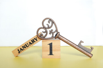 Start new year 2024. Wooden calendar with 1 january word with copy space. Cube calendar with date January 1st, Wooden calendar with date on table in room.