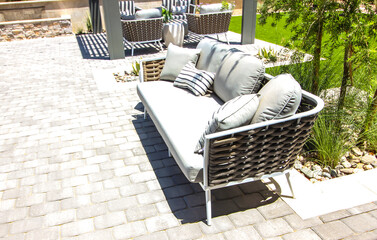 Three Person Couch On Rear Yard Pavers Patio