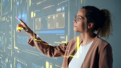 Young Black woman touching futuristic holographic graphical user interface. Digital technology. - Powered by Adobe