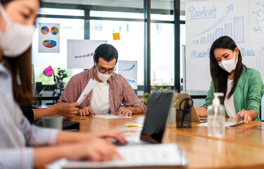 Group of creative asian business meeting and discussing strategy startup project analysis finance process.Success asian business people work plan and brainstorm marketing idea in office.Teamwork