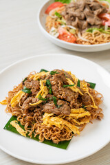 stir-fried instant noodle with pork and egg