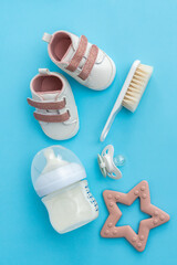  Infant care essentials laid out in a striking top view flat lay, celebrating newborn preparations