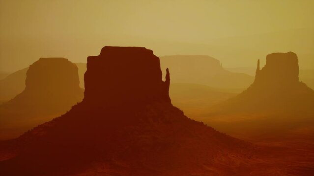 Sunset at the sisters in Monument Valley