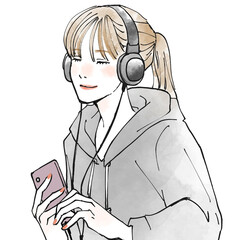 ヘッドホンで音楽を聴く女性