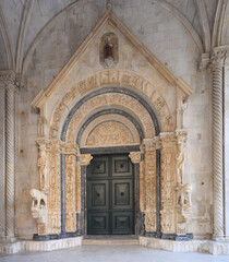 Roman Catholic Basilica entrance in in Trogir, Croatia 