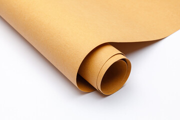 close up of rolled up brown Washable kraft paper on white background with copy space	