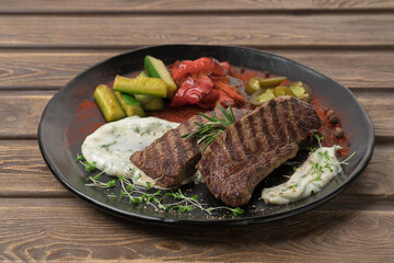 Grilled meat steak on a plate, restaurant menu