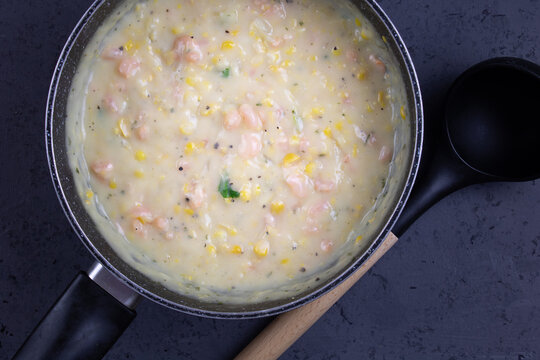 Shrimp and corn chowder - Top view of fish and corn soup with copy space