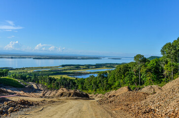 dirt road in taiga with Amur river scenic view near Malmyzh (Nanaysky district, Khabarovsk krai, Russia)