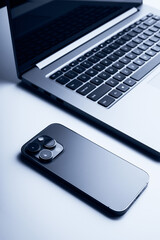 Laptop with smartphone. Close up image. - 639772504