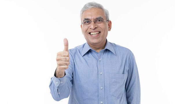 Middle age man doing positive gesture with thumbs up smiling to the camera