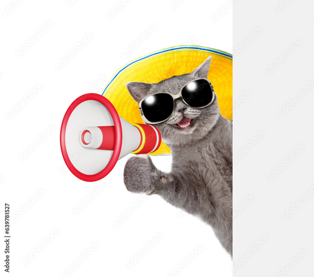 Poster happy cat wearing summer hat talks into megaphone and looks from behind empty white banner. isolated