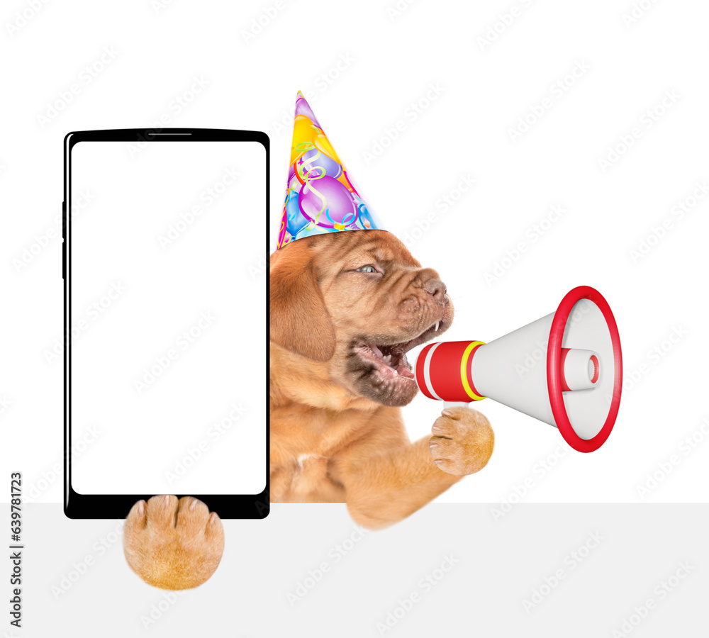 Poster funny mastiff puppy wearing party cap barks into megaphone above empty white banner and shows big sm