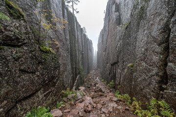 Slattdalsskrevan Canyon in Skuleskogen National Park Narrow crevasse in solid rock Hiking High Coast Trail in Sweden - 639782517