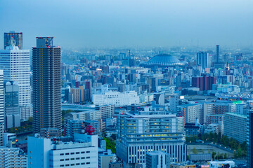 Fototapeta premium A dusk cityscape by high angle view near Kyocera dome in Osaka 