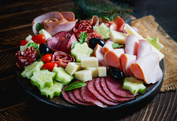 Colorful charcuterie boards and boxes vegetables, meat and cheese.  Assortment of tasty appetizers or antipasti.
