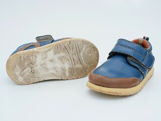 used dirty boy shoes isolated on white