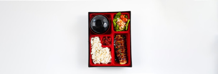 Japanese food bento box set with grilled salmon on Rice  Salad and Main Course. Japanese food isolated on white background