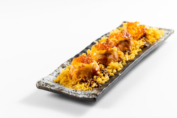 sushi with chopsticks close up. Assorted japanese sushi food. sushi with tuna, crab, salmon, eel and rolls. Japanese food isolated on white background