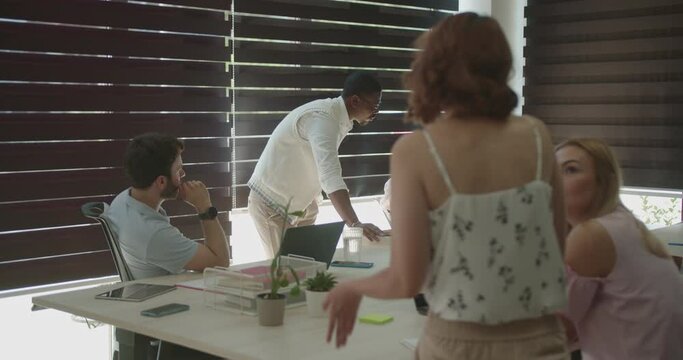 Diverse multirace and gender group of business professionals working together in the modern office