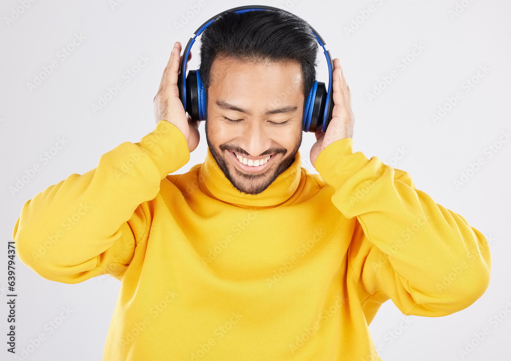 Poster Man, headphones and listening with smile, studio and hearing with streaming subscription by white background. Young Mexican guy, student or fashion model with audio, music and sound with online radio