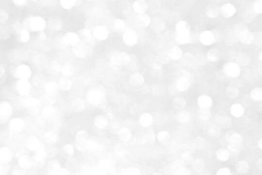 White and gray bokeh background. Photo can be used for the concepts of New Year, Christmas, Wedding Anniversary and all celebrations.