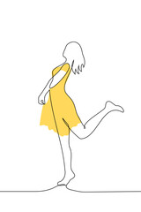 slender woman in a yellow dress silhouette stands in full growth playfully raising her leg - one line art vector. the concept summer dress, female attractiveness, spring mood