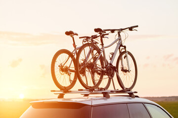 car is transporting bicycles on the roof. roof mount for carrying bikes and baggage. Family car for adventures