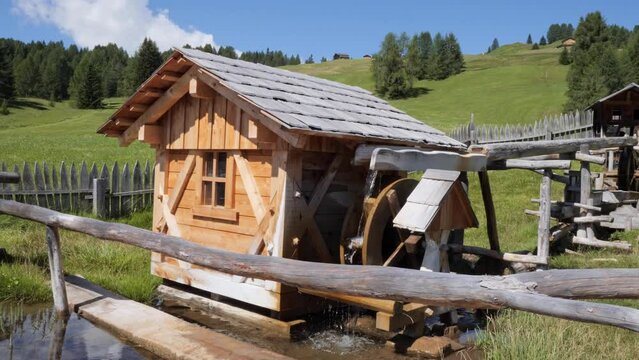 Small Wooden Mill in Operation during a Beautiful, Sunny Summer Day in the Mountains.