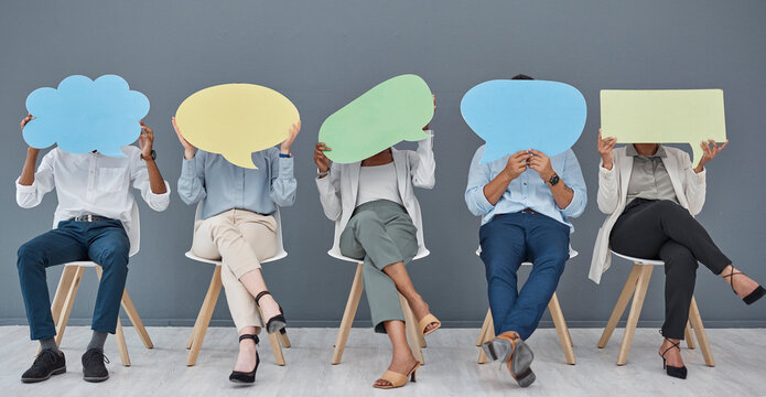 Social media, speech bubble and business people with a sign for opinion in a waiting room for an hr interview. Marketing, advertising or communication with men and woman in the office for recruitment