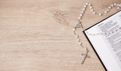 Bible, cross and religion, Christian and God with worship, studying scripture and rosary beads. Jesus Christ, prayer and spiritual, holy book and praise with top view, gospel and mockup space