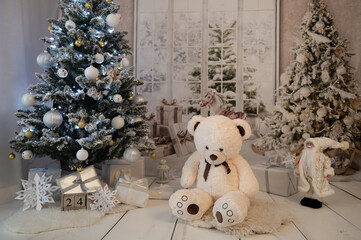 White christmas photo studio backdrop, christmas theme with teddy bear, trees and gifts.