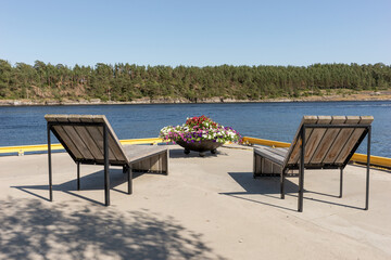 Empty rest area in the sun at the harbor in Langesund. Norway