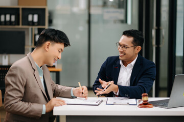 business people and lawyers discussing contract papers sitting at the table. Concepts of law, advice, legal services.
