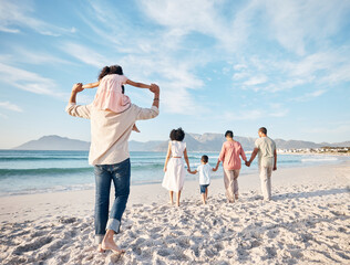 Big family, holiday and walking on beach, holding hands and piggy back on summer island sand from...
