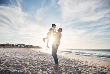 Blue sky, father and child on beach, playing and bonding together on summer vacation in Hawaii....