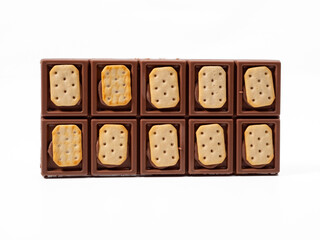 Chocolate with cookies on a white background. Chocolate bar.