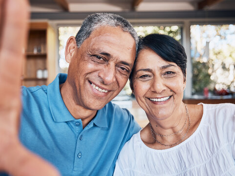 Selfie, happy and portrait of a senior couple bonding together at their modern house on a weekend. Smile, love and face of elderly man and woman in retirement taking a picture at their home in Mexico