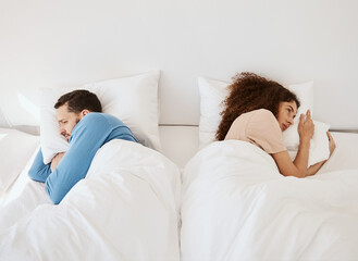 Divorce, ignore and angry couple in bed after fight, argument or dispute in their home from above....