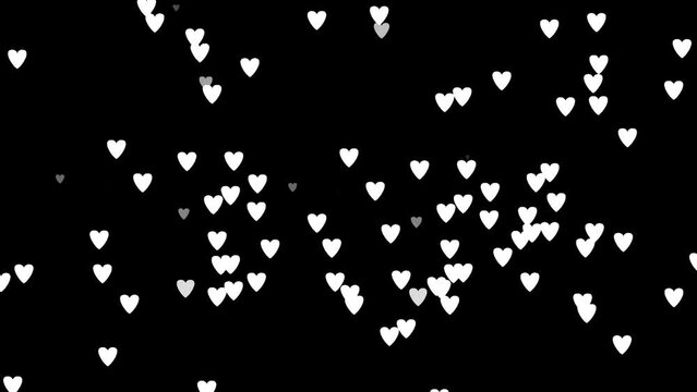 Sprinkling effect of slowly falling hearts on black background. 4K Animations